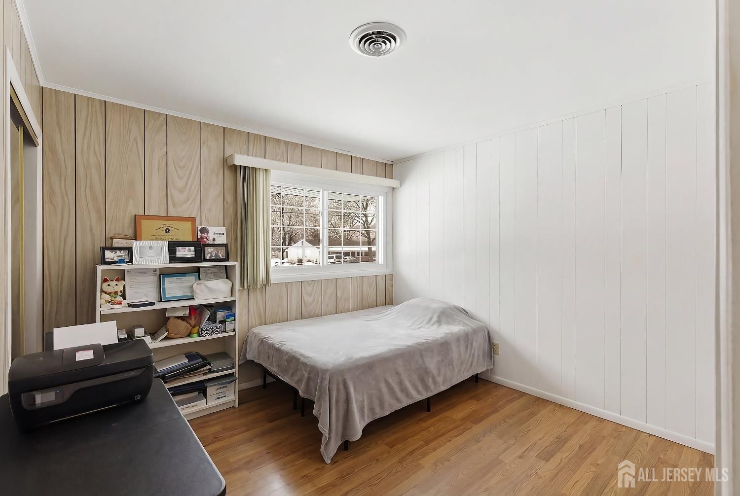 10 Cranston Road Kendall Park, NJ 08824 - Photo 18 of 27 a bedroom with a bed bookshelf and a window