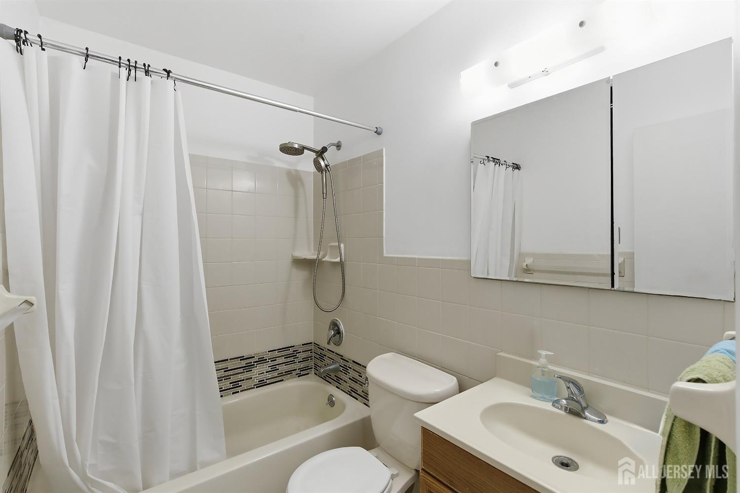 10 Cranston Road Kendall Park, NJ 08824 - Photo 19 of 27 a bathroom with a sink toilet and shower