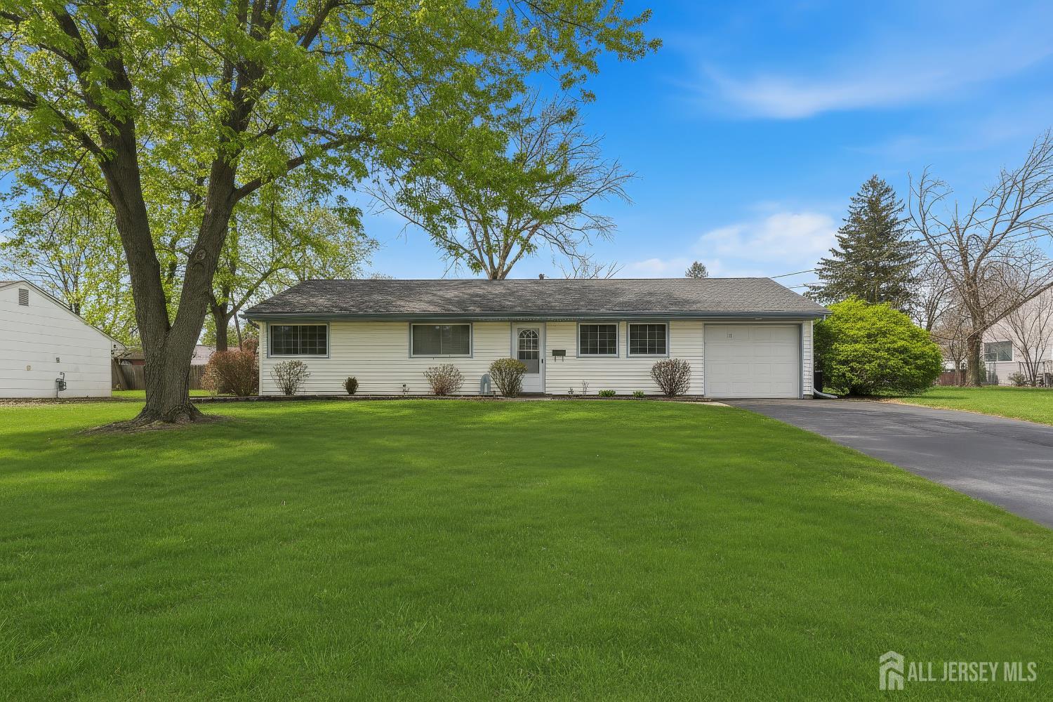 10 Cranston Road Kendall Park, NJ 08824 - Photo 2 of 27 a front view of a house with a garden