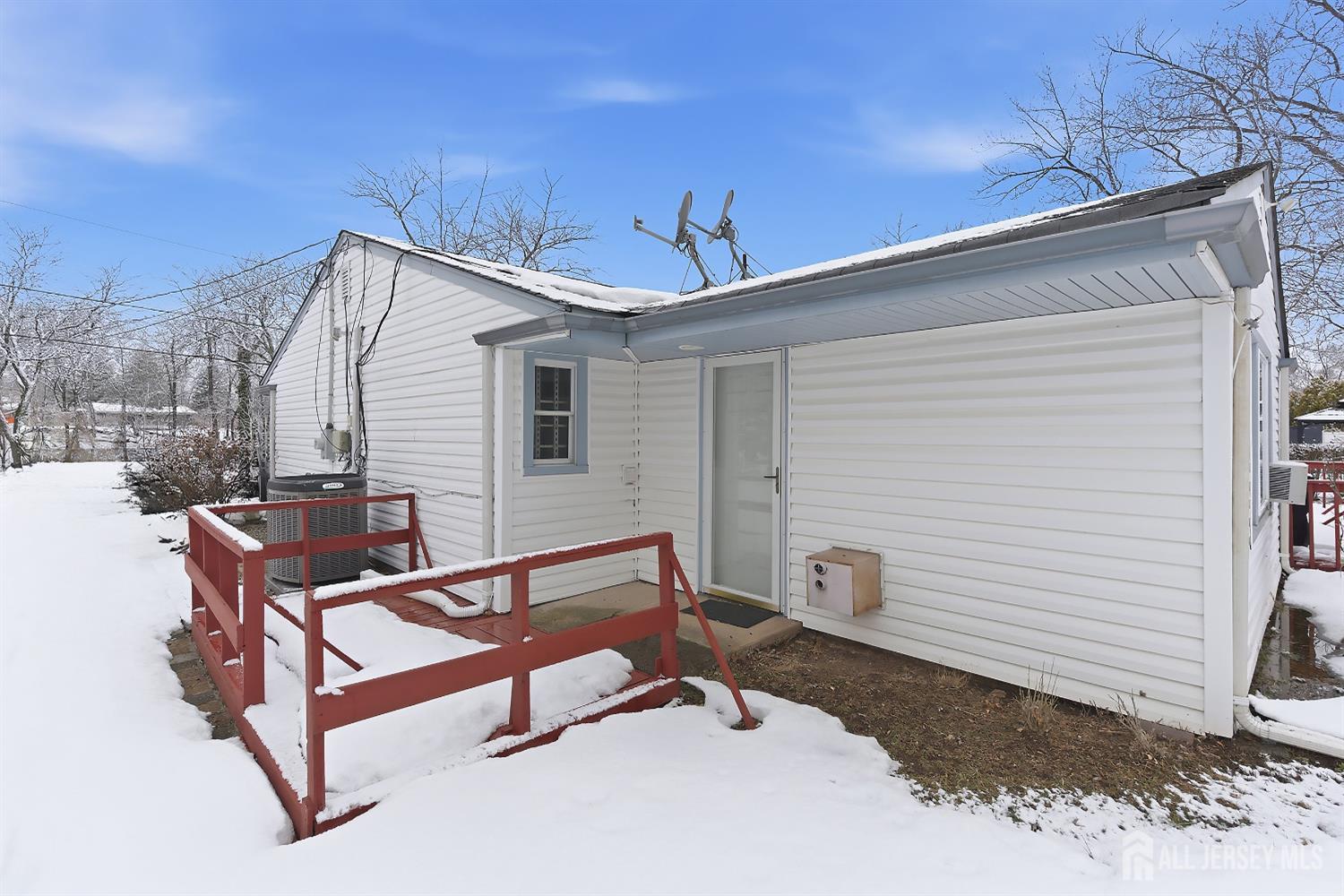 10 Cranston Road Kendall Park, NJ 08824 - Photo 24 of 27 a house view with a backyard space