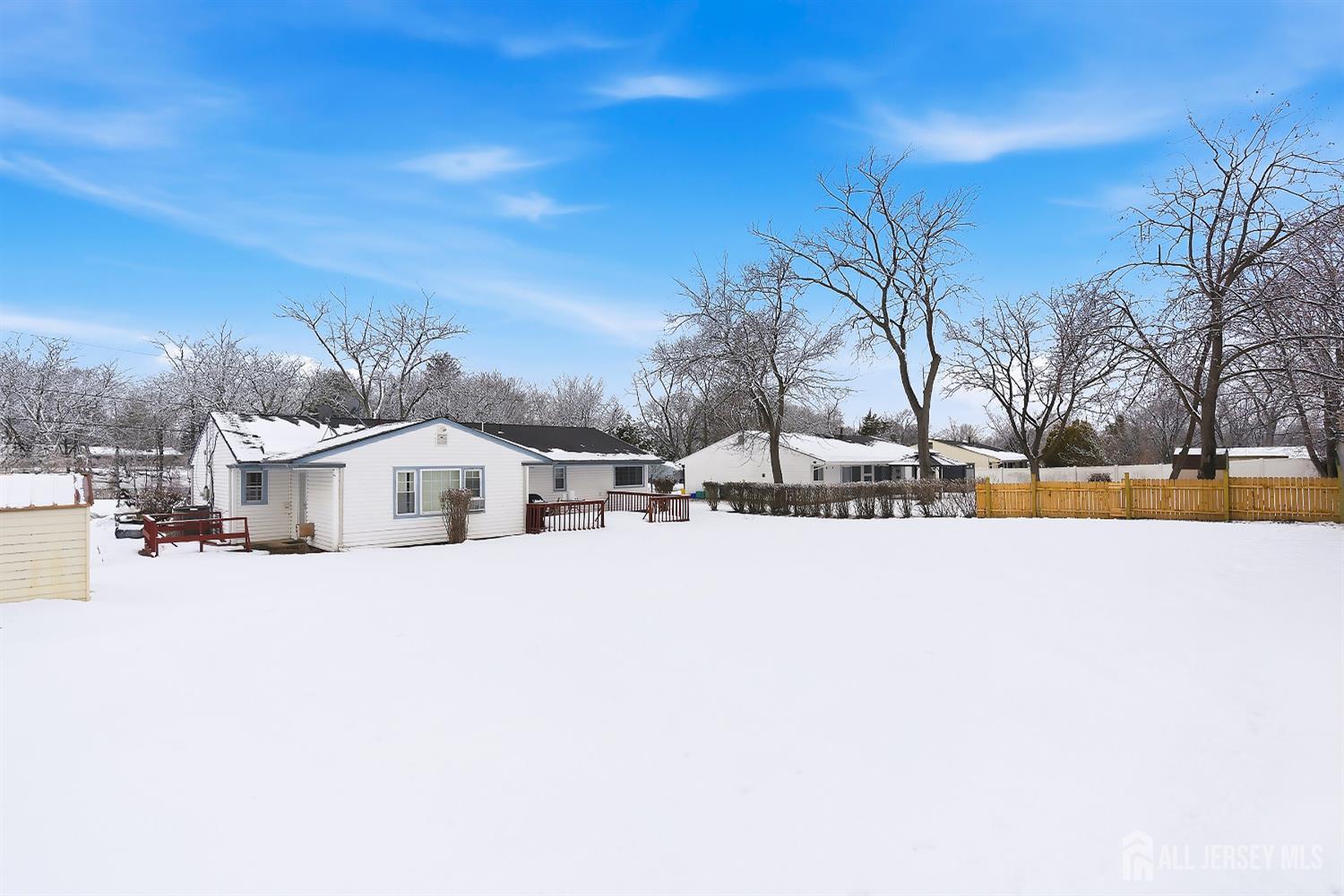 10 Cranston Road Kendall Park, NJ 08824 - Photo 27 of 27 a view of a house with a yard covered with snow in front of house