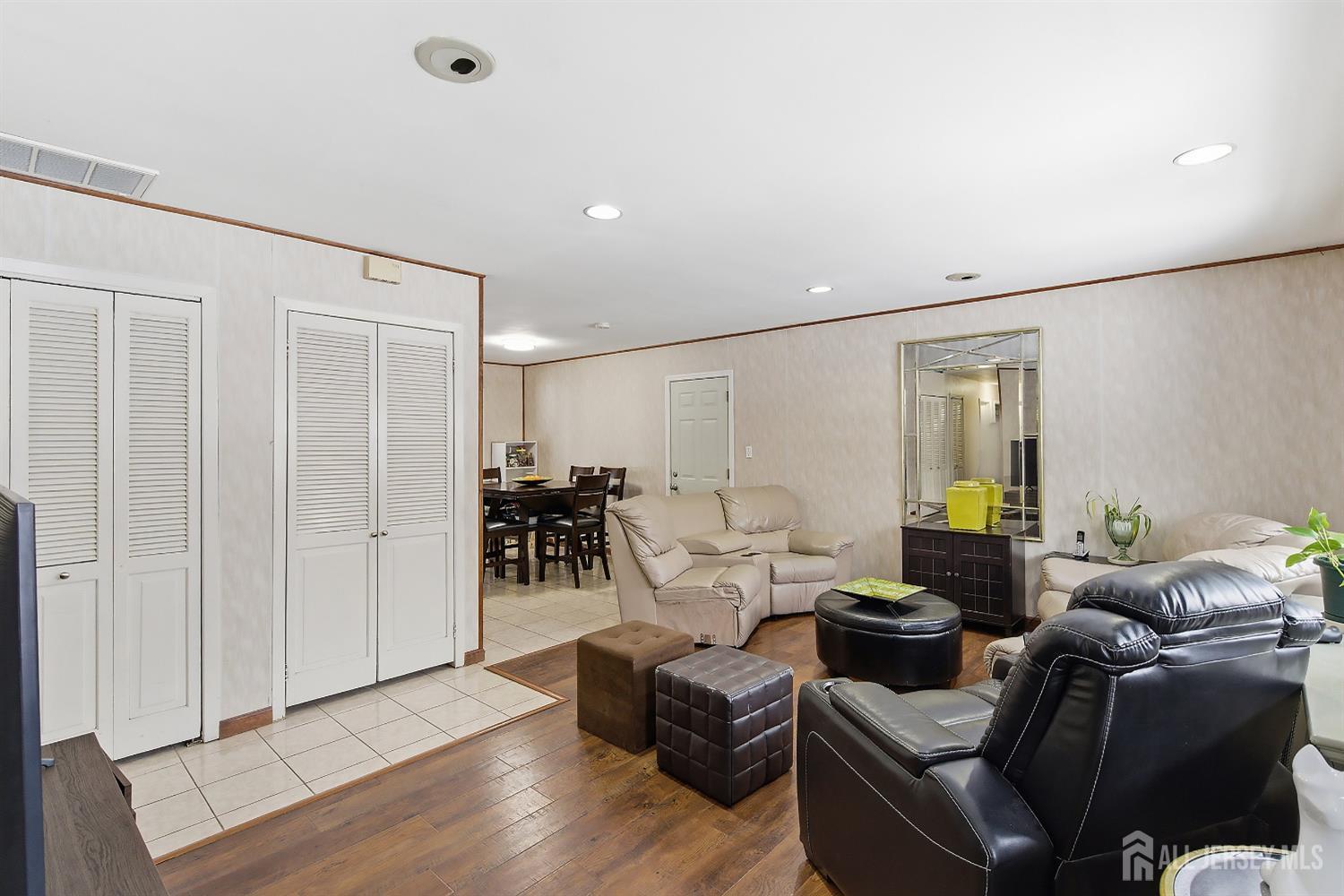 10 Cranston Road Kendall Park, NJ 08824 - Photo 5 of 27 a living room with furniture and a table