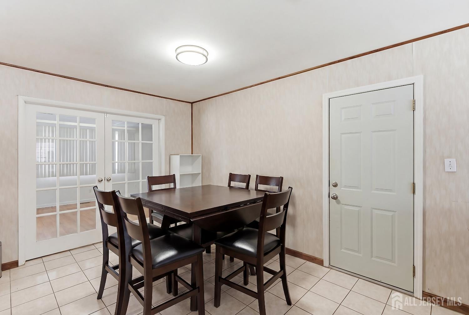 10 Cranston Road Kendall Park, NJ 08824 - Photo 8 of 27 a view of a dining room with furniture and window