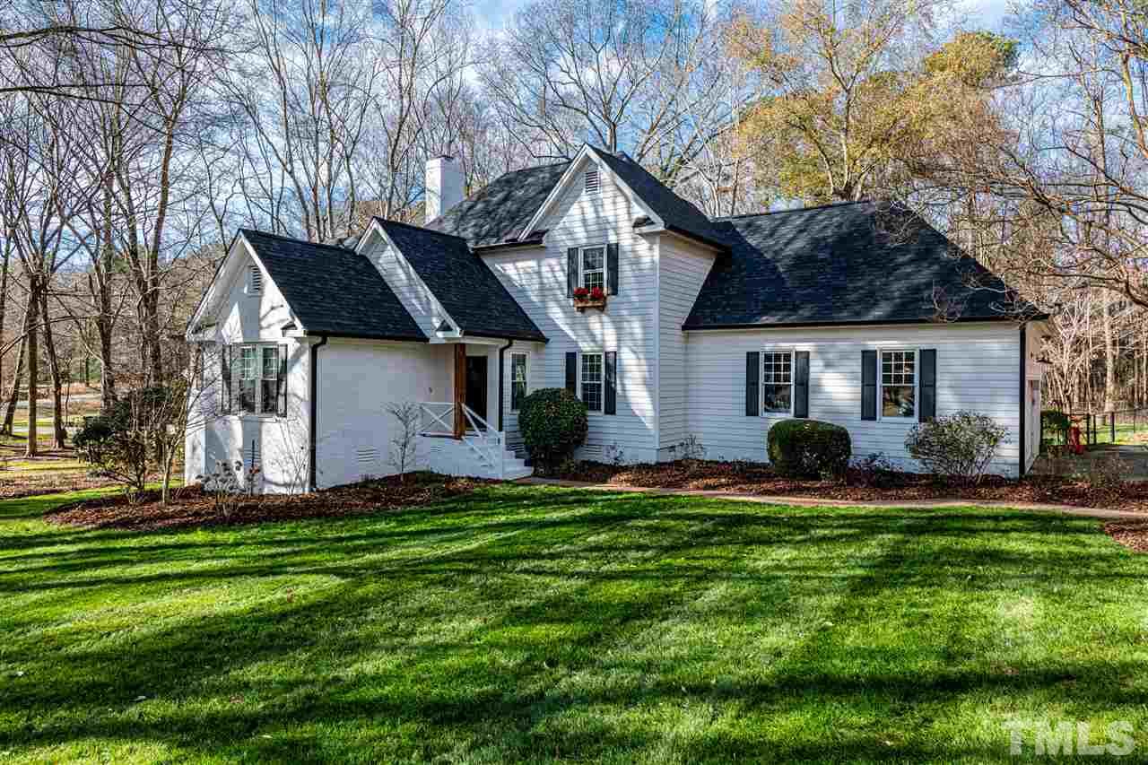 8105 Iron Bark Court Raleigh, NC 27606 - Photo 2 of 30 a front view of house with a garden and patio