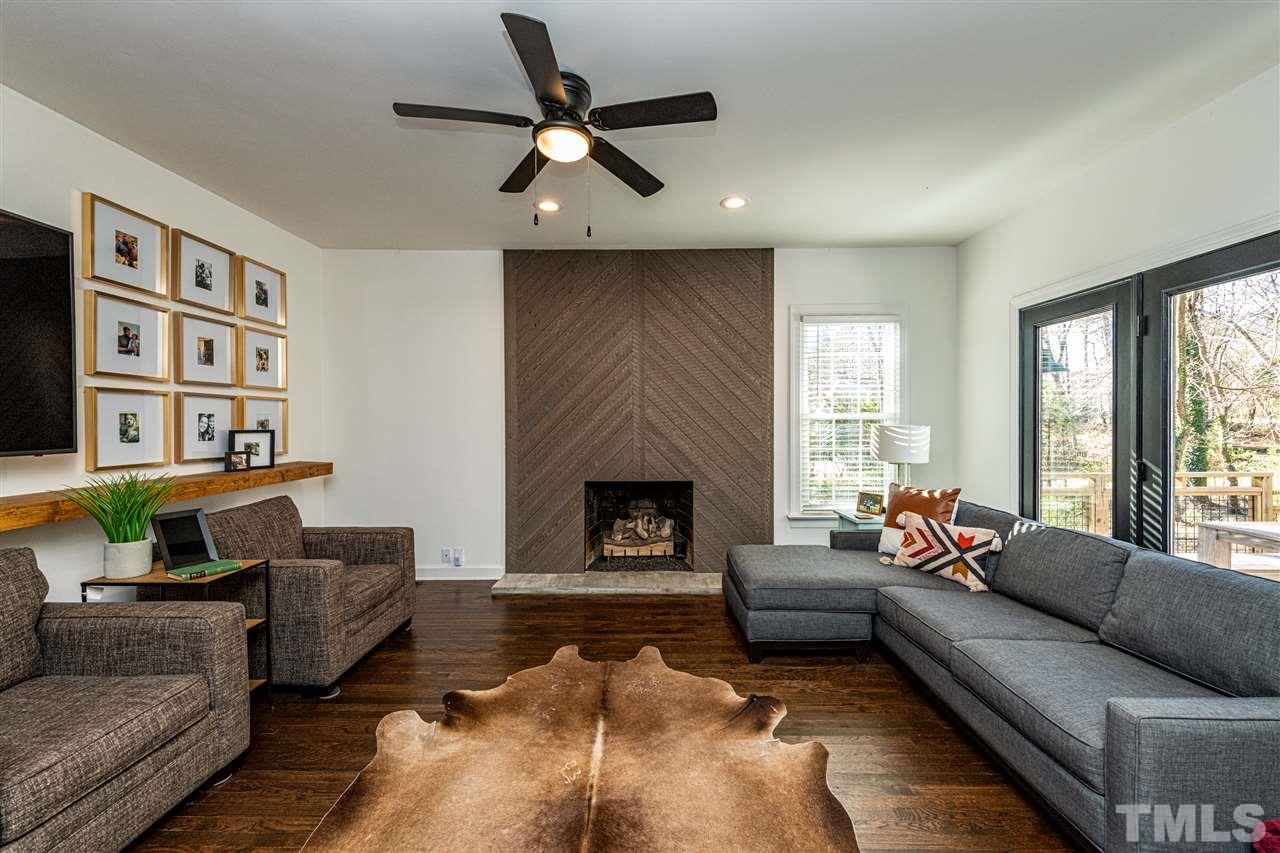 8105 Iron Bark Court Raleigh, NC 27606 - Photo 15 of 30 a living room with furniture and a fireplace