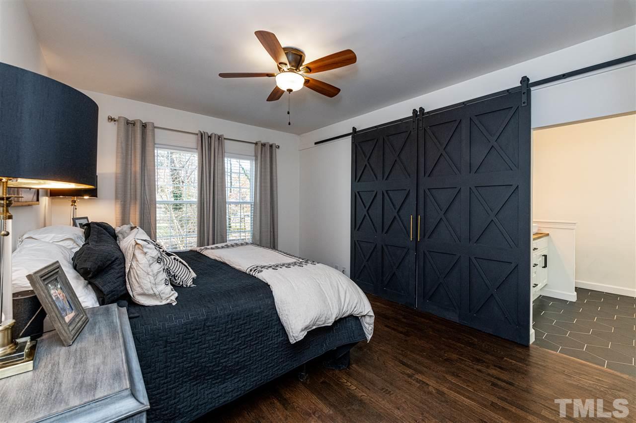 8105 Iron Bark Court Raleigh, NC 27606 - Photo 16 of 30 a bedroom with a bed and a window