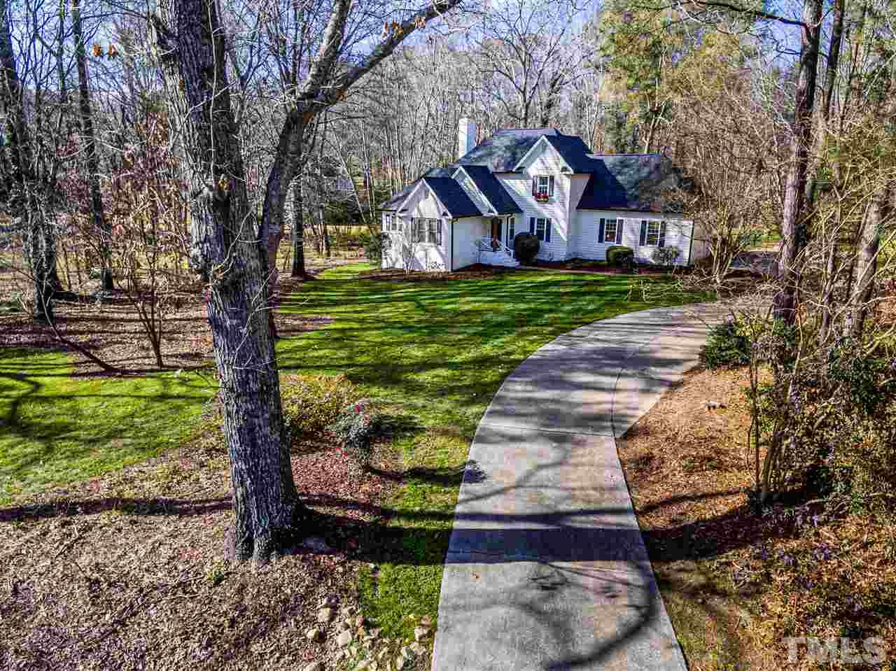 8105 Iron Bark Court Raleigh, NC 27606 - Photo 3 of 30 a front view of a house with garden