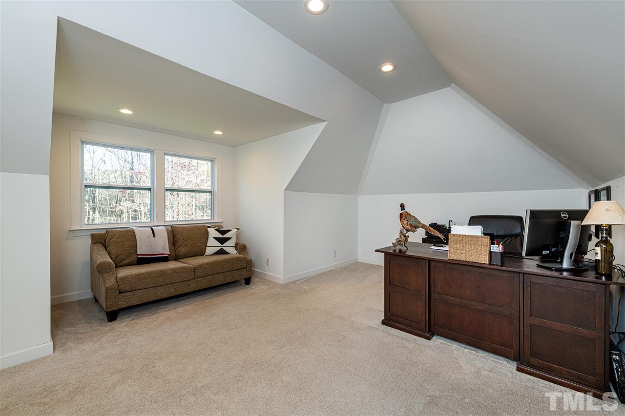 8105 Iron Bark Court Raleigh, NC 27606 - Photo 23 of 30 a living room with furniture and a window