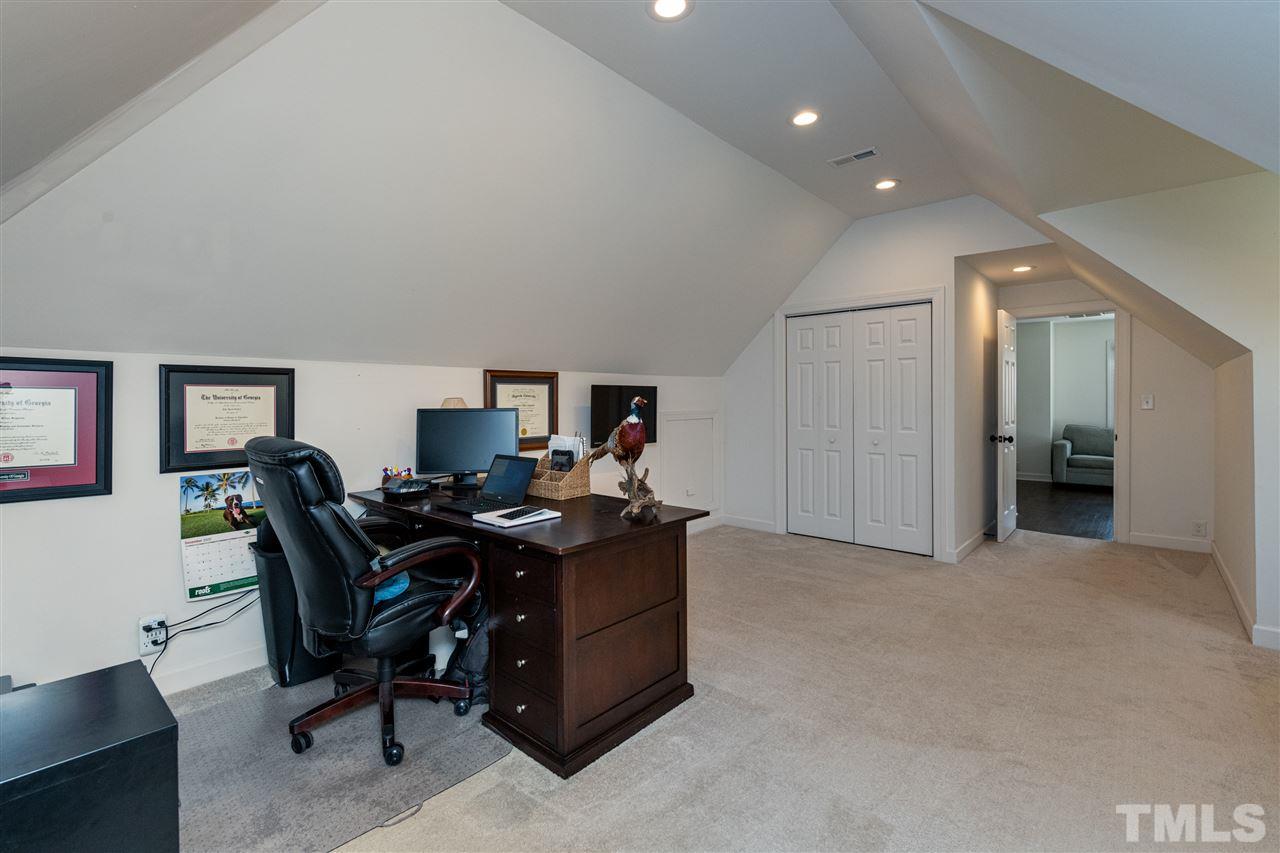 8105 Iron Bark Court Raleigh, NC 27606 - Photo 24 of 30 a view of a workspace with furniture