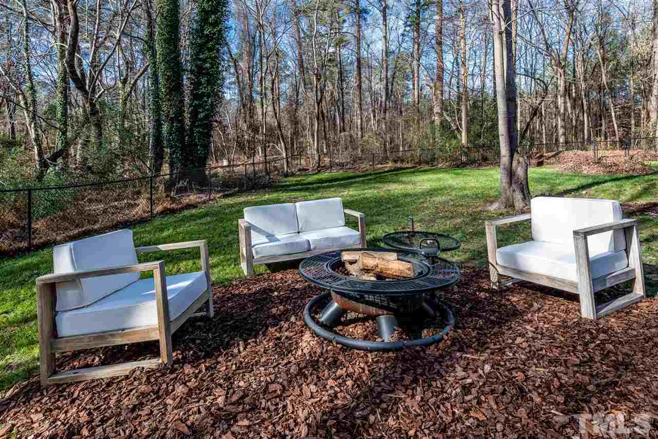 8105 Iron Bark Court Raleigh, NC 27606 - Photo 26 of 30 a view of a backyard with plants and a garden