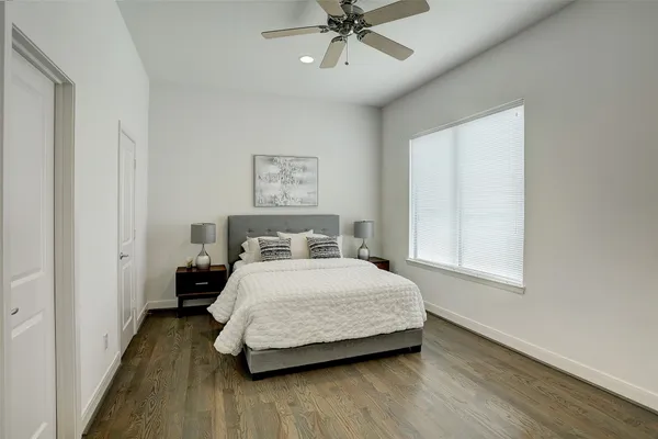a bedroom with a bed and window