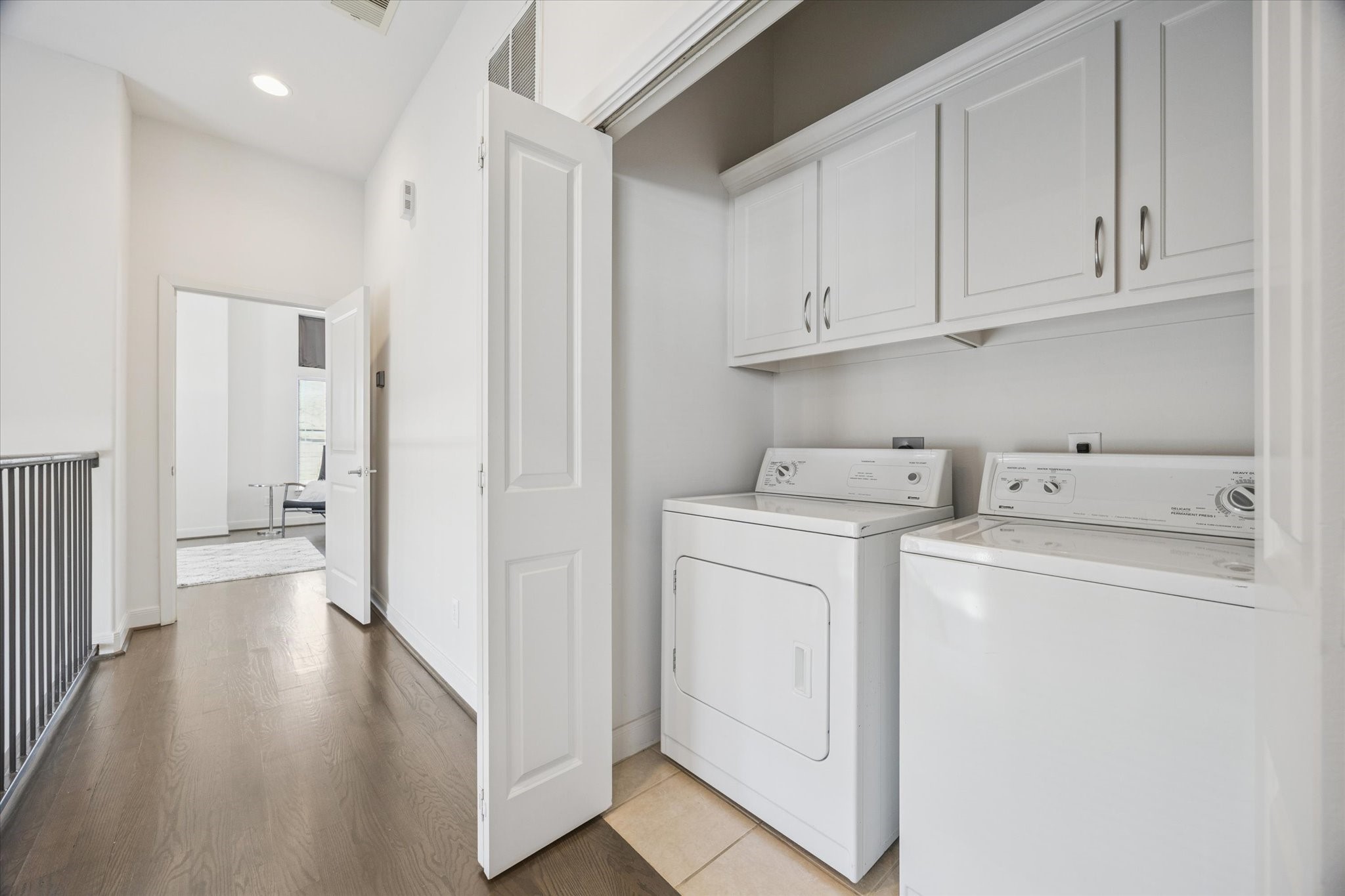 902 Roy Street Houston, TX 77007 - Photo 23 of 50 a view of storage and utility room with wooden floor