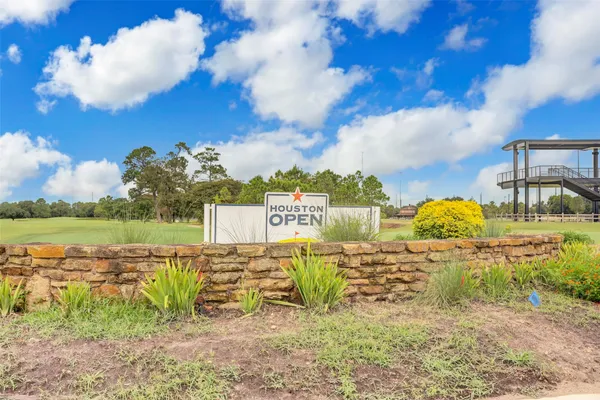 a front view of a house with a big yard