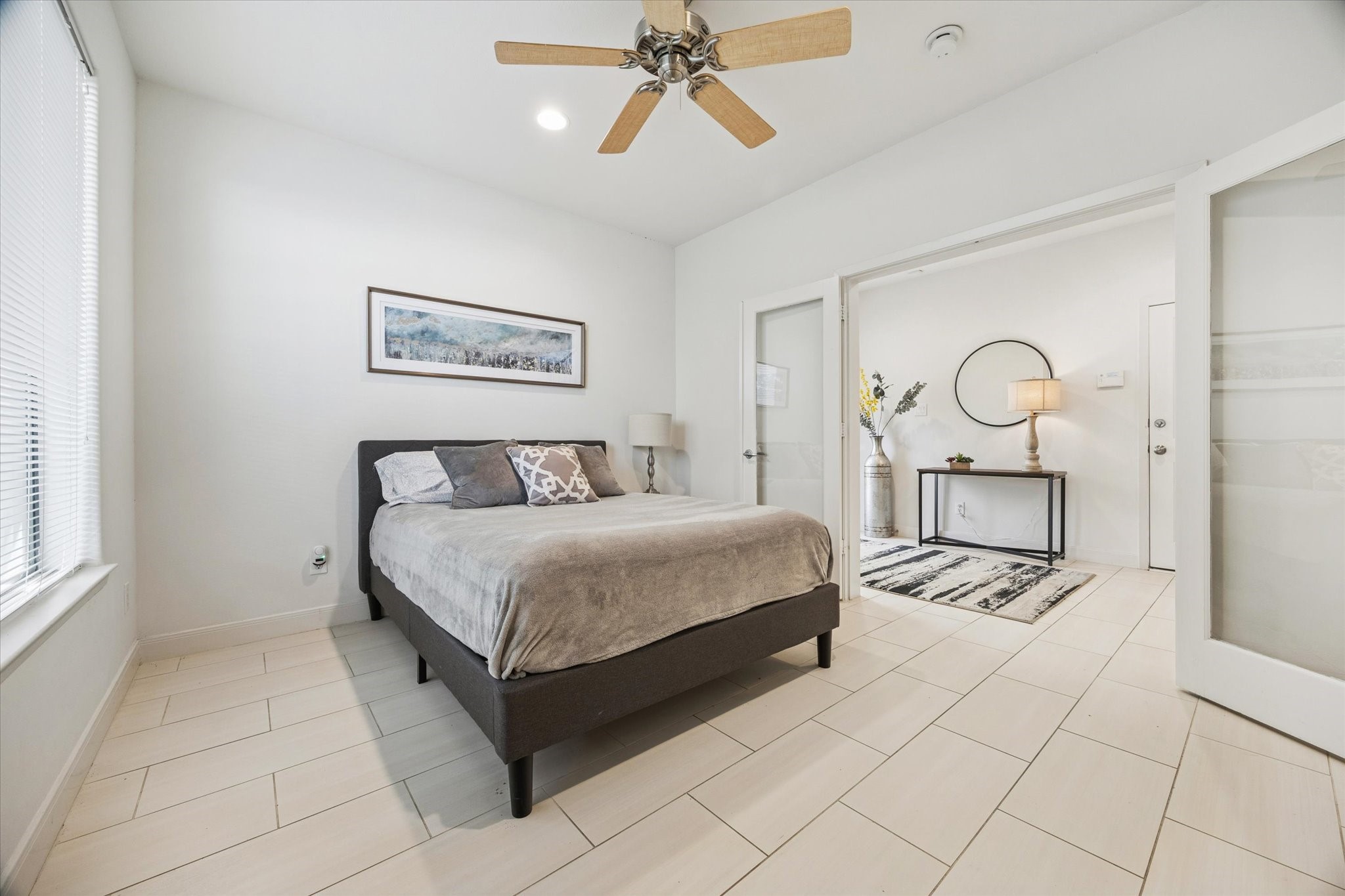 902 Roy Street Houston, TX 77007 - Photo 10 of 50 a bedroom with a bed and window