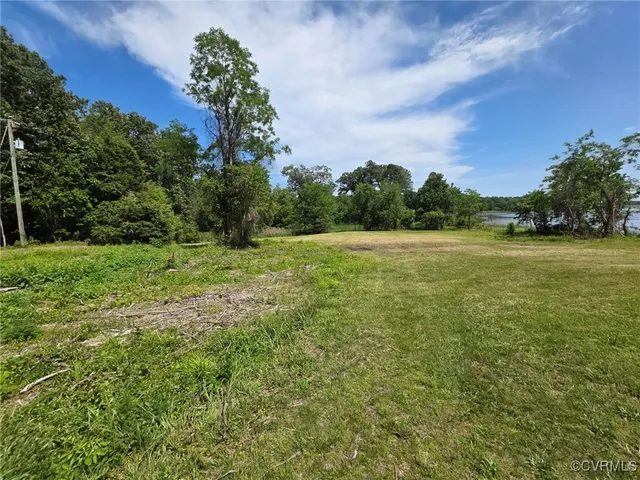 a view of a field with an trees