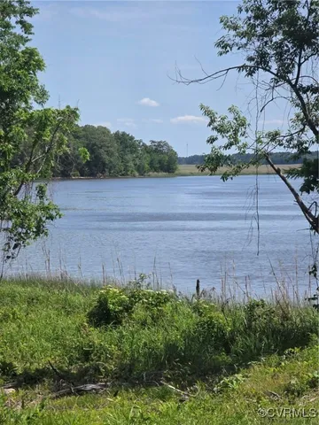 a view of a lake and a yard