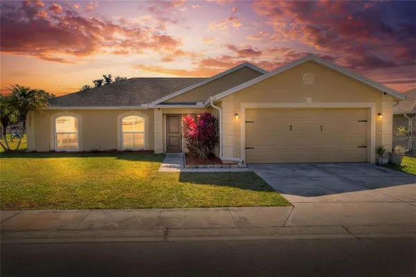 a front view of a house with yard