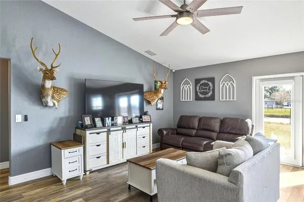 a living room with furniture and window
