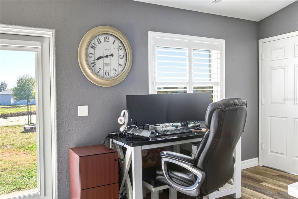 533 Seven Oaks Street Mulberry, FL 33860 - Photo 20 of 43 a view of a workspace with furniture and a window