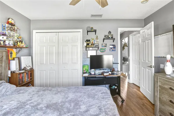 a bedroom with furniture and a window