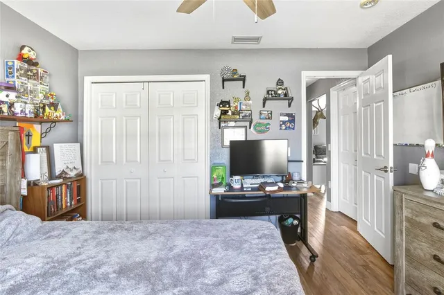 a bedroom with furniture and a window