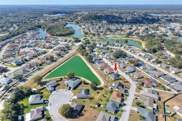 an aerial view of a houses with a outdoor space