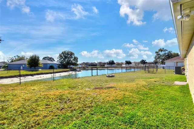 a view of a swimming pool with an outdoor space and seating area