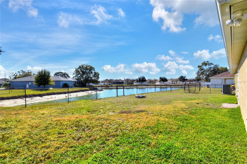 533 Seven Oaks Street Mulberry, FL 33860 - Photo 35 of 43 a view of a swimming pool with an outdoor space and seating area