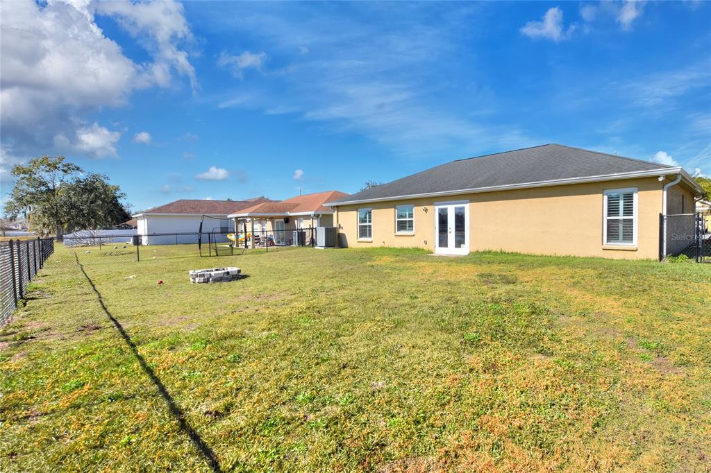 533 Seven Oaks Street Mulberry, FL 33860 - Photo 36 of 43 a view of a house with a yard