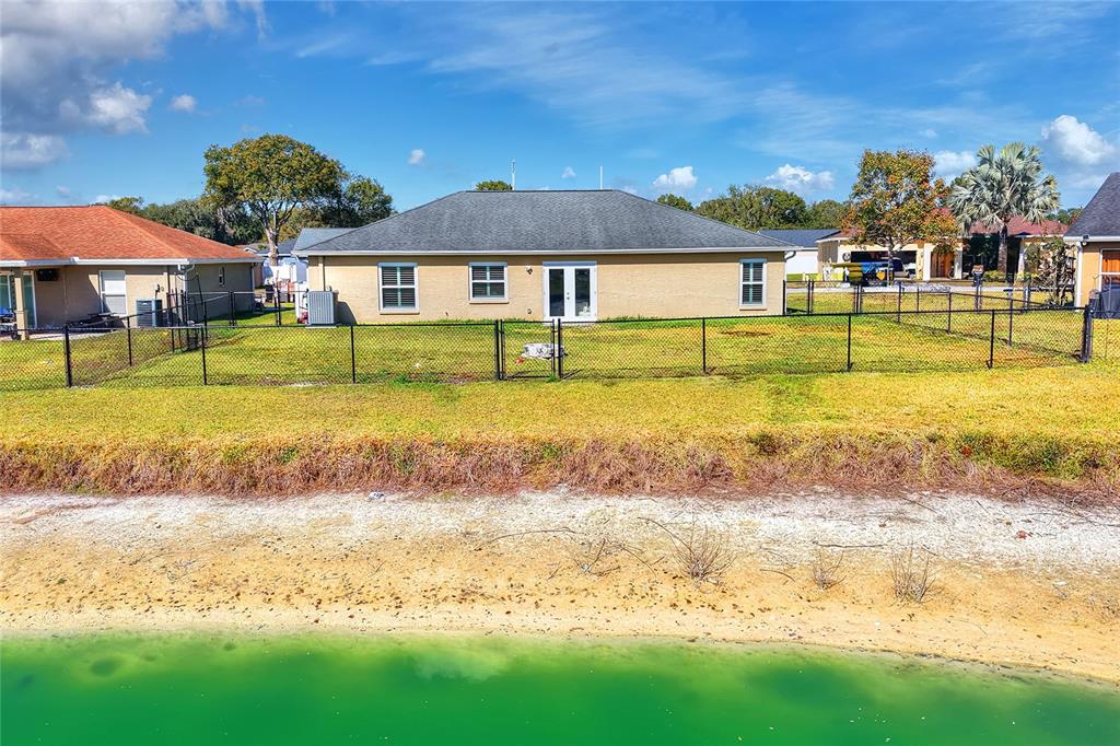 533 Seven Oaks Street Mulberry, FL 33860 - Photo 37 of 43 a front view of a house with swimming pool having outdoor seating