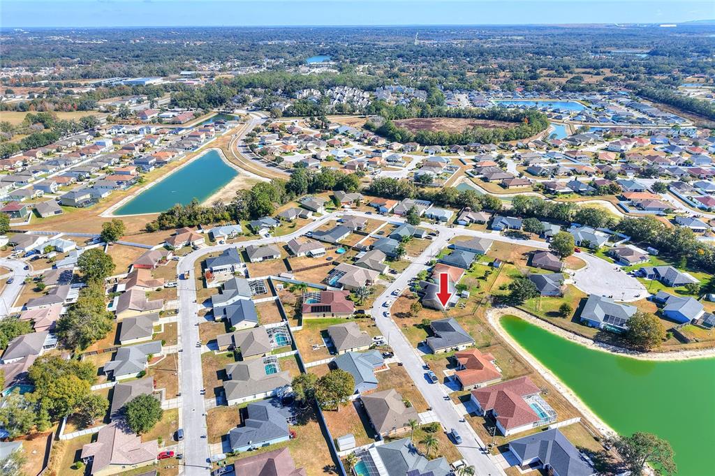 533 Seven Oaks Street Mulberry, FL 33860 - Photo 41 of 43 an aerial view of residential houses with outdoor space