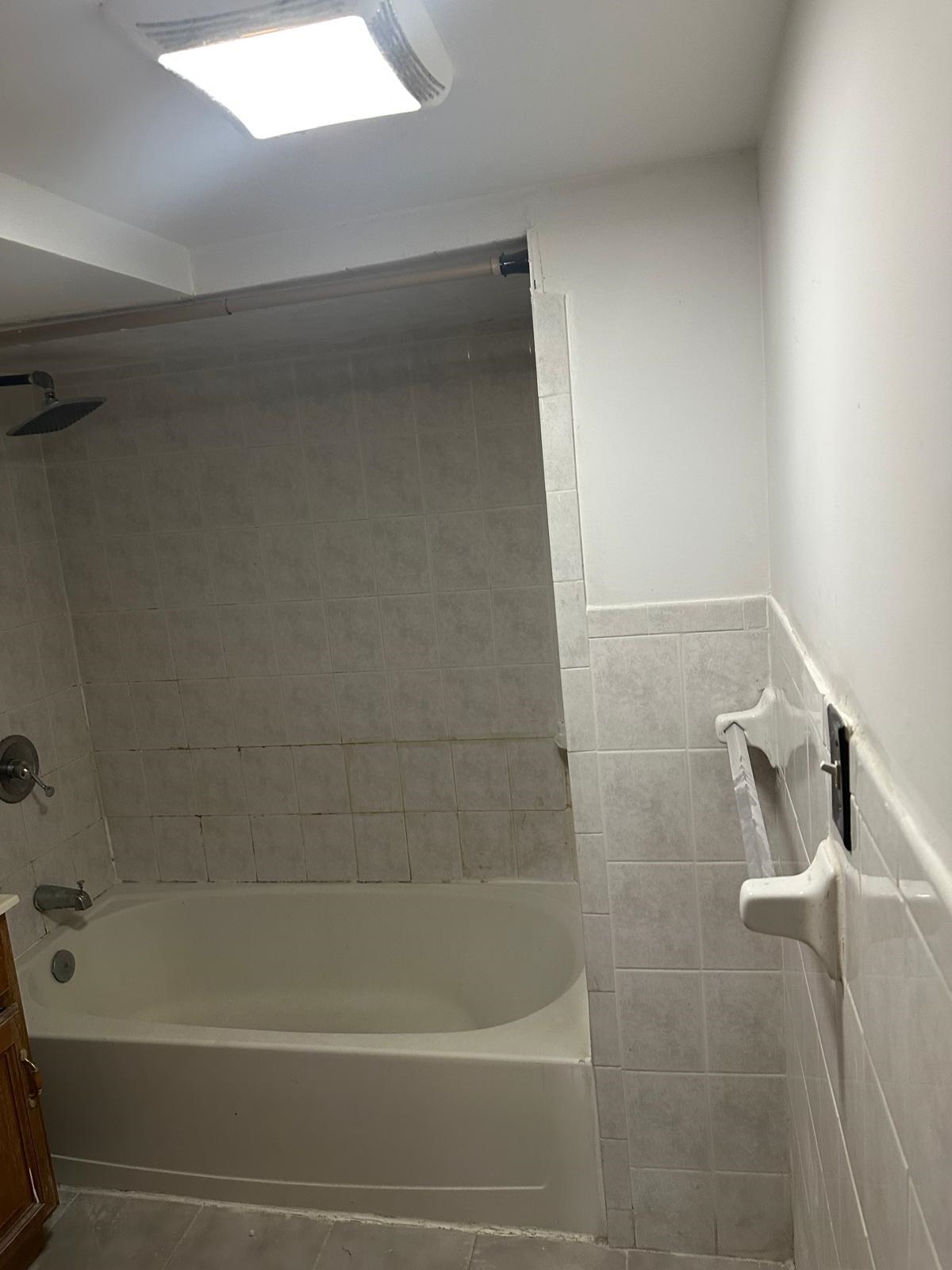 31 East 32nd Street, Unit 2 Bayonne, NJ 07002 - Photo 11 of 19 a bathroom with a shower and a bathtub