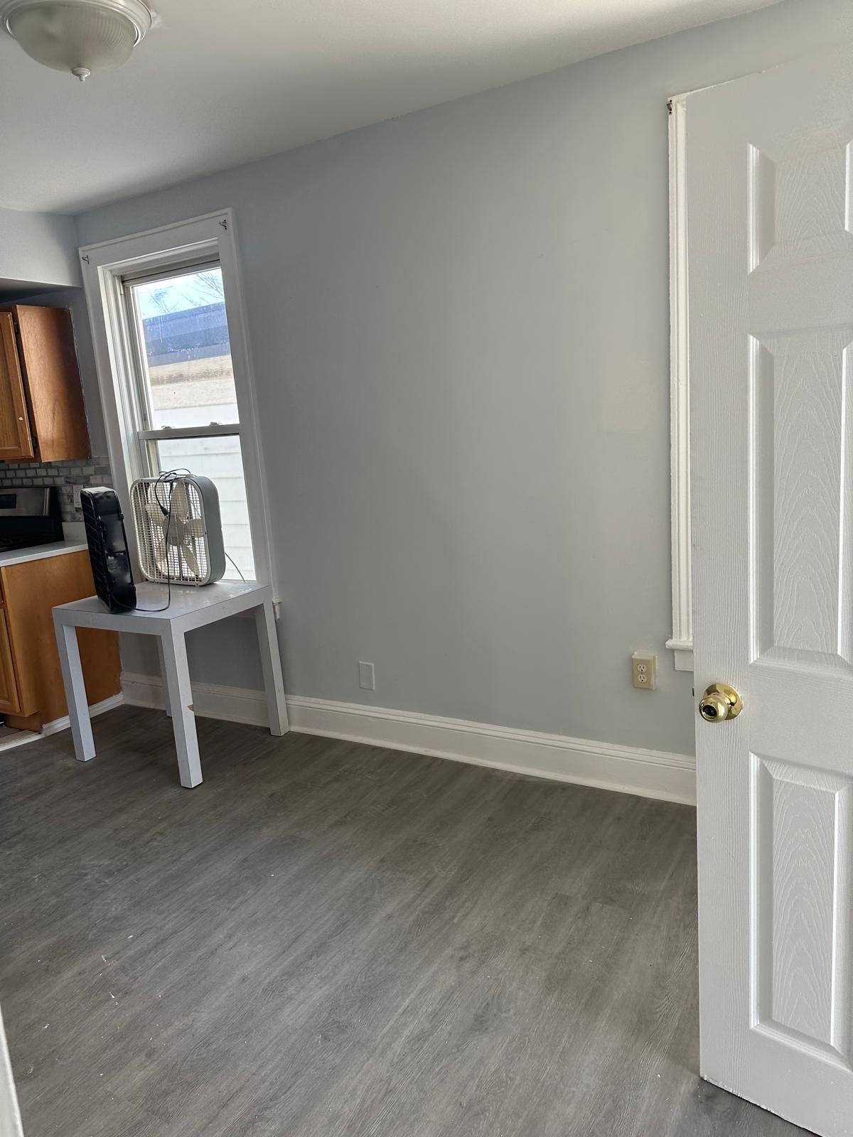 31 East 32nd Street, Unit 2 Bayonne, NJ 07002 - Photo 12 of 19 wooden floor in an empty room with a window