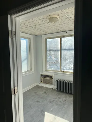 a view of an empty room with a window