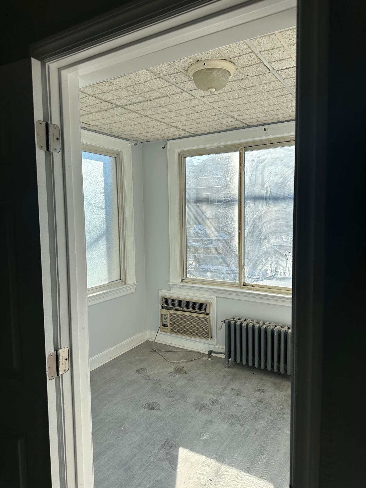 31 East 32nd Street, Unit 2 Bayonne, NJ 07002 - Photo 3 of 19 a view of an empty room with a window