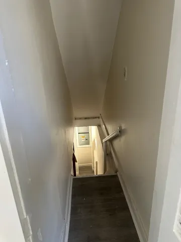 a view of a hallway with a white walls