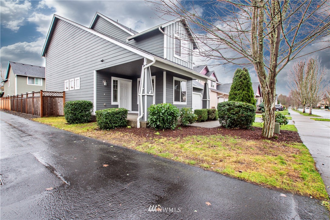 6912 Radius Loop Southeast Lacey, WA 98513 - Photo 28 of 30 a front view of house with yard and trees around