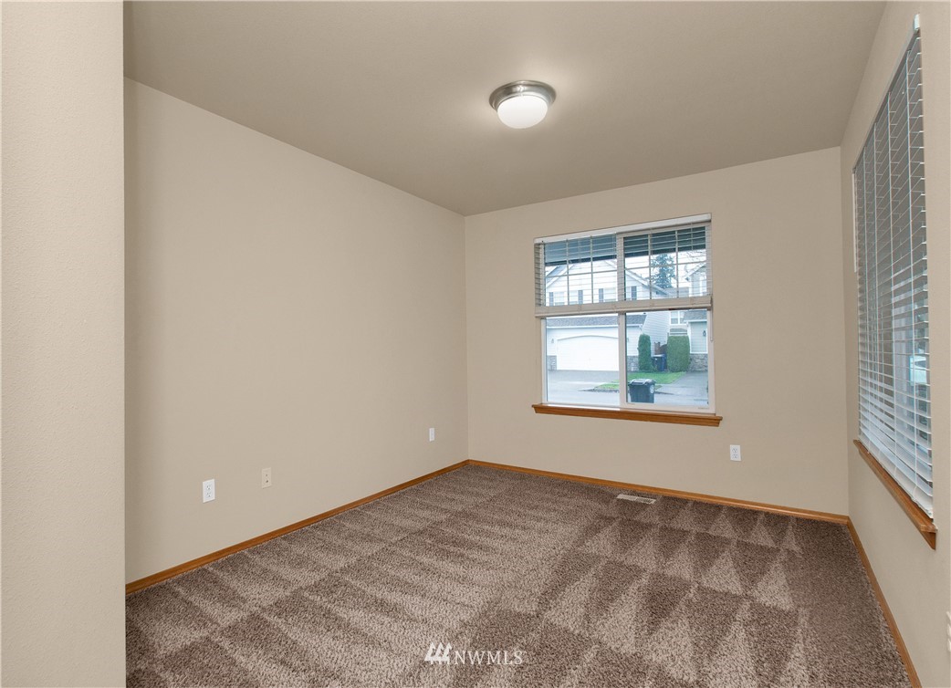 6912 Radius Loop Southeast Lacey, WA 98513 - Photo 9 of 30 an empty room with windows