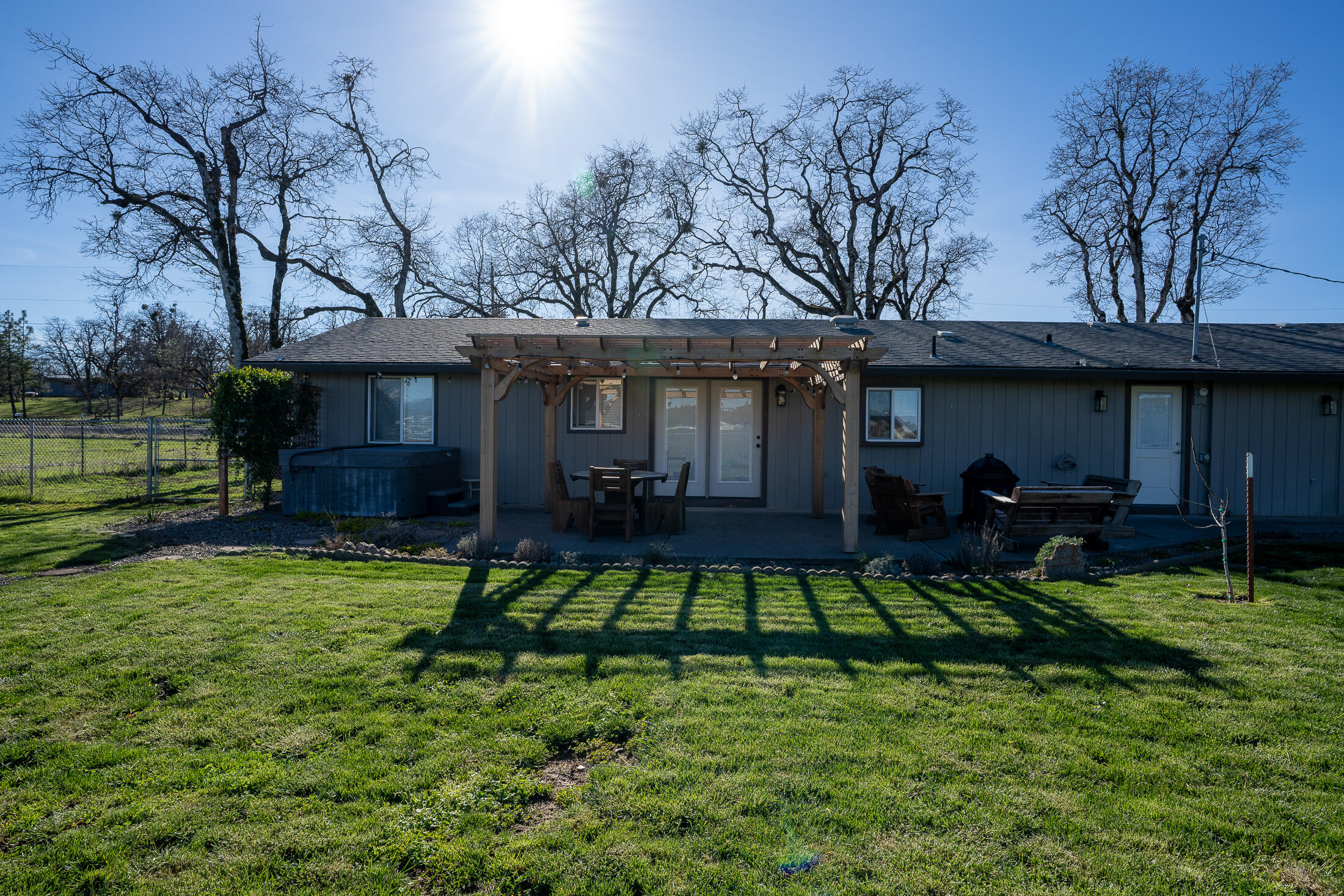 15882 Antioch Road White City, OR 97503 - Photo 38 of 49 a view of a house with backyard porch and sitting area