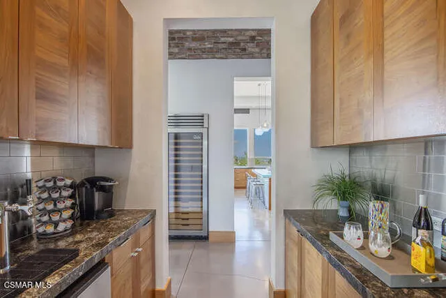 a view of a bathroom with a shower and a sink