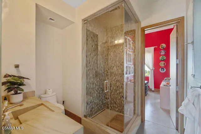 a bedroom with a bed and a couch