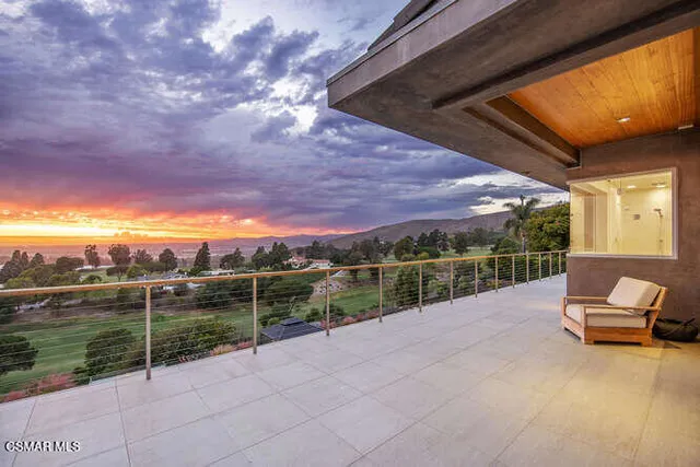 a view of a swimming pool and lounge chair