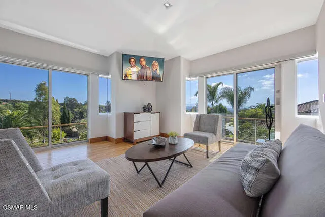 an aerial view of a house with a swimming pool