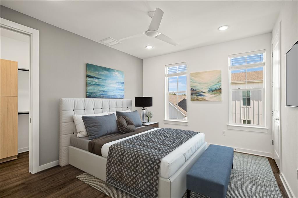 2624 Metcalfe Road, Unit 8 Austin, TX 78741 - Photo 11 of 32 A view of the primary bedroom. To the left is the walk-in closet and to the right is additional closet space.