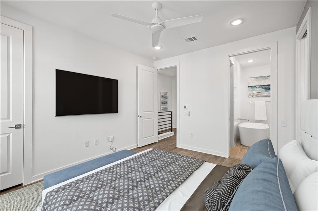 2624 Metcalfe Road, Unit 8 Austin, TX 78741 - Photo 12 of 32 Another view of the primary bedroom. On the far left is a walk-in closet and to the right is the entrance to the primary bathroom and a larger walk-in closet.
