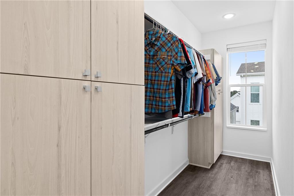 2624 Metcalfe Road, Unit 8 Austin, TX 78741 - Photo 13 of 32 The primary closet has an entrance into the master bedroom and the master bath. It also has a window and 2 spacious built-in closets.
