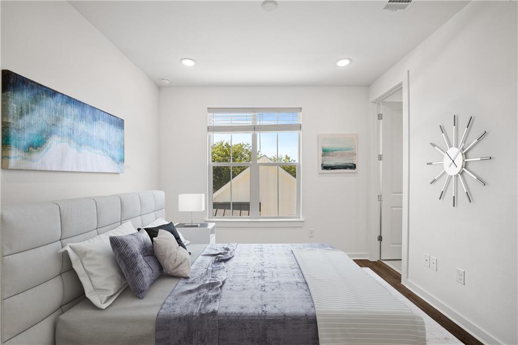 2624 Metcalfe Road, Unit 8 Austin, TX 78741 - Photo 16 of 32 Bedroom # 3 is located on the same floor as the primary bedroom but on opposite ends of the floor. To the left is full bathroom #3 located ensuite.