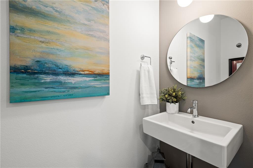 2624 Metcalfe Road, Unit 8 Austin, TX 78741 - Photo 21 of 32 The half bath is located just off the kitchen.