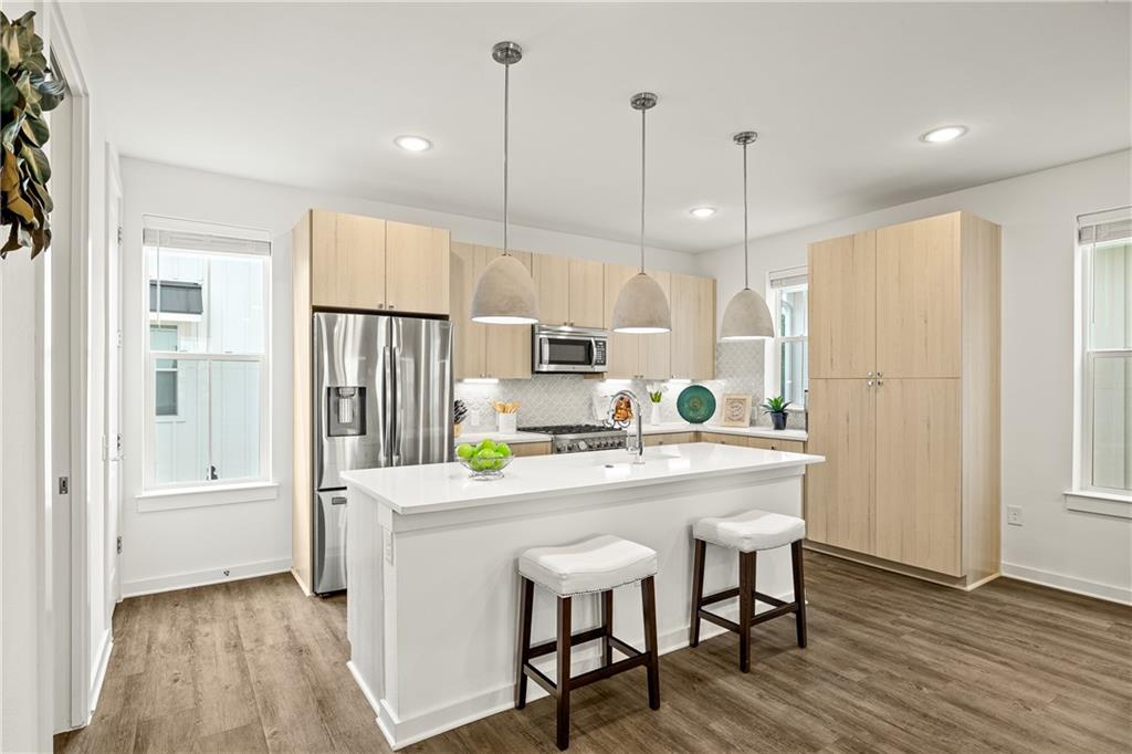 2624 Metcalfe Road, Unit 8 Austin, TX 78741 - Photo 3 of 32 The kitchen features a Scandinavian design and upgraded stainless steel appliances.