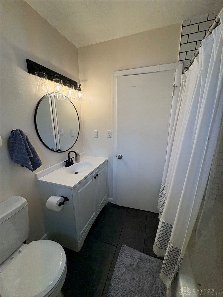 1513 Ridgeway Drive Springfield, OH 45506 - Photo 41 of 53 It also features sleek fixtures and a tiled floor, creating a clean and inviting atmosphere.